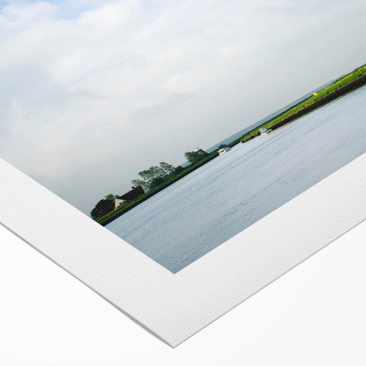 Vibrant rolled canvas showcasing a picturesque landscape with windmills against a bright blue sky, perfect for home decor or art enthusiasts.