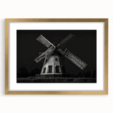 Framed wall art collection featuring a picturesque landscape with windmills, showcasing a gold mat and frame, perfect for home decor aesthetics.