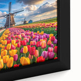 Framed canvas artwork showcasing a vibrant landscape with windmills, featuring rich colors and intricate details, perfect for home decor enhancement.