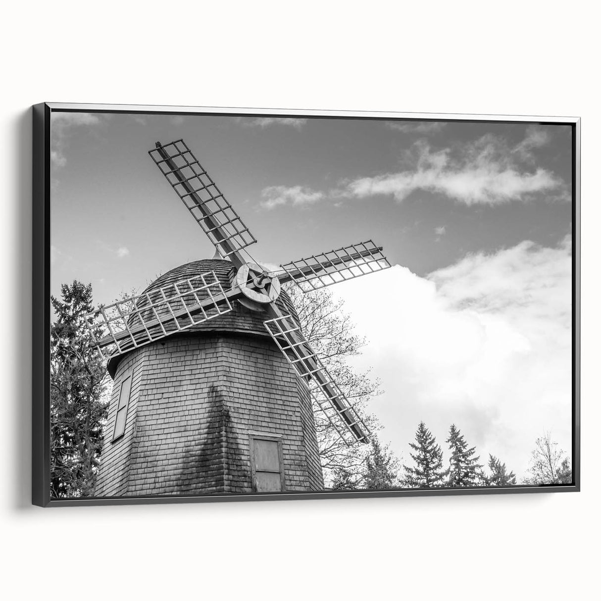 Framed canvas wall art showcasing a picturesque landscape with windmills, featuring a black frame and side view, perfect for home decor and interior styling.