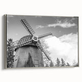 Framed wall art featuring a serene landscape of windmills against a sunset backdrop, showcasing vibrant colors and detailed textures, perfect for home décor.