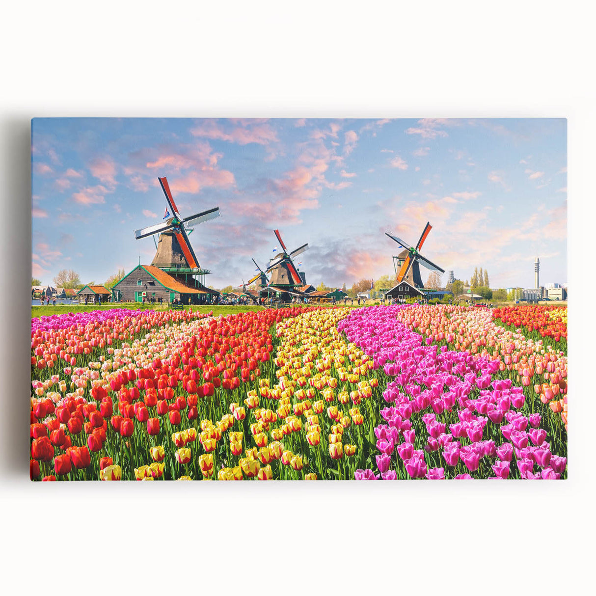 Stretched canvas wall art collection showcasing a serene landscape with windmills, featuring vibrant colors and a tranquil blue sky, ideal for home decor.