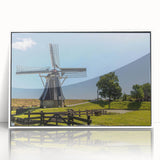 Framed acrylic wall art showcasing a serene landscape with windmills, set in a sleek white frame, ideal for enhancing home decor with a touch of tranquility.