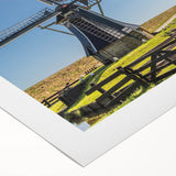 Rolled canvas art showcasing a serene landscape with windmills against a vibrant sunset, perfect for home decor and enhancing interior aesthetics.