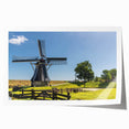 Colorful landscape wall art print featuring traditional windmills against a vibrant sunset, showcasing intricate details and rich hues, rolled for easy display.