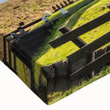 Close-up of a stretched canvas featuring a vibrant landscape design with windmills, showcasing rich colors and intricate details, perfect for home decor.