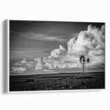 Framed canvas wall art showcasing a serene landscape with windmills, featuring a white frame and side view, perfect for enhancing home decor with a touch of elegance.