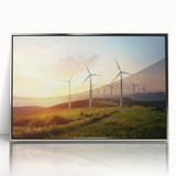 Framed acrylic wall art featuring a serene landscape with windmills against a vibrant sunset, showcasing intricate details and a stylish silver frame. This elegant piece adds a touch of nature-inspired decor to any space, perfect for enhancing home or office interiors.