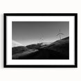 Framed wall art collection showcasing a serene landscape with windmills, featuring a black mat and sleek black frame, perfect for home decor and aesthetic enhancement.