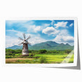 Vibrant rolled print of a serene landscape featuring windmills against a sunset backdrop, perfect for enhancing home decor with a touch of tranquility.