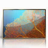 Framed wall art featuring an intricate marine life coral design, with vibrant colors, gold accents, and a sleek acrylic front, perfect for ocean-themed decor.