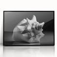 Framed wall art featuring a vibrant marine life coral design, showcasing intricate colors and details, set against a sleek black frame for elegant decor.