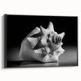 Framed canvas wall art showcasing a vibrant marine life coral design, featuring intricate details in blues and greens, with a sleek black frame, perfect for ocean-themed decor.