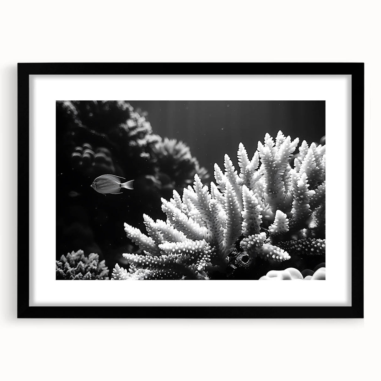 Framed wall art featuring a vibrant coral reef design, showcasing intricate marine life illustrations in vivid colors, set in a sleek black frame with a mat.