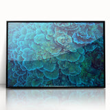 Framed acrylic wall art showcasing a vibrant marine life coral design, featuring shades of blue, orange, and green against a sleek black frame, ideal for ocean-themed decor.