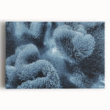 Vibrant coral reef wall art on stretched canvas, showcasing colorful marine life and intricate coral designs in a coastal setting. Perfect for ocean-themed decor.