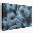 Stretched canvas wall art showcasing a vibrant marine life coral design, featuring intricate details in blues and oranges, ideal for ocean-themed decor.