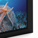 Vibrant close-up of a framed canvas wall art piece showcasing intricate marine life and coral design, featuring rich blues, oranges, and detailed textures, perfect for ocean-themed decor.