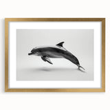 Framed wall art display featuring a marine life dolphin design, elegantly presented in a gold frame with a mat, perfect for ocean-themed decor.