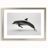 Framed wall art collection featuring a dolphin design, showcasing vibrant marine life colors. The artwork is elegantly presented in a silver frame with a mat, perfect for ocean-themed decor.