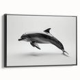 Framed canvas wall art featuring a detailed dolphin design in a marine life theme, with a sleek black frame, perfect for ocean-themed decor.