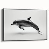 Framed canvas wall art featuring a detailed dolphin design in a marine life theme, with a sleek black frame, perfect for ocean-themed decor.