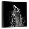 Framed canvas wall art featuring a vibrant dolphin design in shades of blue and green, showcased from a black side view, ideal for marine life enthusiasts.