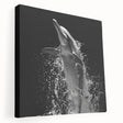 Stretched canvas wall art showcasing a vibrant dolphin design in a marine life theme, perfect for ocean lovers and coastal decor enthusiasts. The artwork features rich blues and intricate details, adding a playful touch to any space.