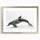 Framed wall art featuring a beautiful dolphin design set against a calming ocean backdrop, with a silver frame and matting that enhances its elegance. Perfect for marine life enthusiasts and coastal decor lovers.