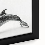 Close-up of a framed canvas wall art piece showcasing a vibrant dolphin design, with intricate marine life details and oceanic colors, perfect for coastal decor.