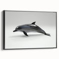 Framed wall art featuring a marine life dolphin design on textured canvas, showcasing vibrant blue colors and a sleek black frame, ideal for ocean-themed decor.