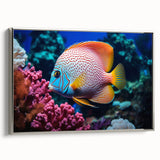 Framed canvas wall art featuring a vibrant marine life fish design, elegantly displayed with a silver frame, perfect for ocean-themed decor in homes or offices.