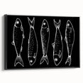 Framed wall art featuring a vibrant marine life fish design, showcasing colorful fish and aquatic elements on a black background, viewed from the side. Perfect for ocean-themed decor.