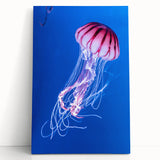 Stretched canvas wall art showcasing a vibrant jellyfish design in shades of blue and purple, adding a modern marine life touch to any decor. Perfect for ocean lovers!