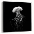 Framed canvas wall art showcasing a vibrant jellyfish design in shades of blue and purple, set against a sleek black frame, ideal for marine life enthusiasts.