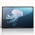 Framed wall art showcasing a vibrant jellyfish design in shades of blue and purple, set against a sleek black frame, perfect for marine life enthusiasts.