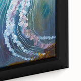 Close-up of a framed canvas wall art piece featuring a vibrant jellyfish design, showcasing intricate details and colors, ideal for marine life enthusiasts.