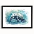 Black-framed wall art showcasing a vibrant marine life design featuring a manatee, ideal for ocean-themed decor. Perfect for adding a touch of coastal charm.