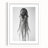 Framed octopus wall art design showcasing vibrant marine life colors in a white mat, perfect for ocean-themed decor and adding a touch of elegance to any room.