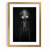 Framed wall art featuring an octopus design in vibrant colors with a gold frame, ideal for marine life enthusiasts and coastal decor. Perfect for adding a touch of oceanic elegance to any room.