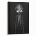 Framed canvas wall art featuring a vibrant octopus design in shades of blue and green, set against a black background, showcasing marine life decor ideal for ocean-themed interiors.