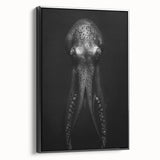 Framed canvas wall art featuring a vibrant octopus design in shades of blue and green, set against a black background, showcasing marine life decor ideal for ocean-themed interiors.
