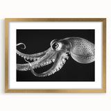 Gold-framed wall art featuring a vibrant octopus design amidst marine life, perfect for ocean-themed decor. The artwork is elegantly matted, enhancing its visual appeal and sophistication.