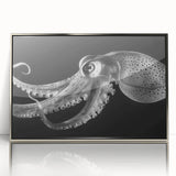 Framed wall art featuring a vibrant octopus design in various colors, set in a sleek silver frame, perfect for marine-themed home decor.