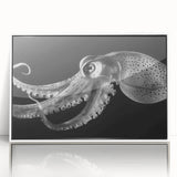 Framed wall art featuring a vibrant octopus design in shades of blue and purple, set against a white background, perfect for marine life enthusiasts and coastal decor.