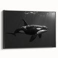 Framed canvas wall art depicting a striking orca design, showcasing vibrant marine life colors on a black background, perfect for ocean-themed decor.