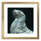 Elegant wall art featuring a sea lion design with a gold frame and mat, ideal for marine life enthusiasts. The piece showcases intricate details, perfect for home decor.