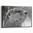 Framed wall art featuring a vibrant sea otter design against a black background, showcasing marine life in a playful pose, ideal for ocean-themed decor.
