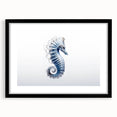 Black-framed wall art featuring a vibrant marine life seahorse design, ideal for ocean-themed decor, showcasing intricate details and colors. Perfect for enhancing home aesthetics.