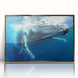 Framed wall art featuring a stunning gold-accented whale design, showcasing intricate marine life details against a vibrant blue background, ideal for ocean-themed decor.